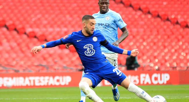 Chelsea's Moroccan midfielder Hakim Ziyech shoots to score the opening goal of the English FA Cup semi-final football match between Chelsea and Manchester City at Wembley Stadium in north west London on April 17, 2021. Adam Davy / POOL / AFP