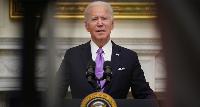 US President Joe Biden speaks about the Covid-19 response before signing executive orders in the State Dining Room of the White House in Washington, DC, on January 21, 2021. MANDEL NGAN / AFP