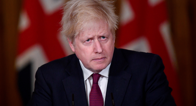 Britain's Prime Minister Boris Johnson attends a virtual press conference inside 10 Downing Street in central London on December 19, 2020. TOBY MELVILLE / POOL / AFP